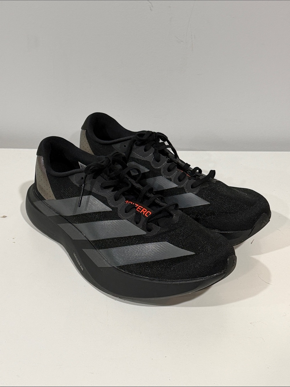 adidas Evo SL Black Athletic Running Shoes with Gray Stripes